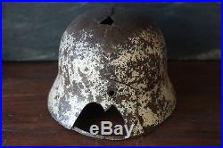 100% original german ww2 helmet winter camo, battle damaged shell. Stalingrad