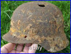 #52 WWII Germany German Original War Damaged Relic Combat Helmet STILL IN CLAY