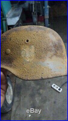 German WW2 Helmet Dug with a bullet hole