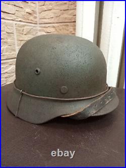ORIGINAL 1000% combat German helmet M-35 size 64. EF64 serial number 772