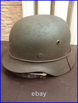 ORIGINAL 1000% combat German helmet M-35 size 64. EF64 serial number 772