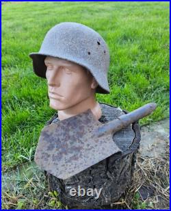 Original German Helmet M40/66 and Sapper Shovel Wehrmacht Uniform World War 2 Original German Helmet M40/66 and Sapper Shovel Wehrmacht Uniform World War 2