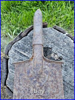 Original German Helmet M40/66 and Sapper Shovel Wehrmacht Uniform World War 2 Original German Helmet M40/66 and Sapper Shovel Wehrmacht Uniform World War 2