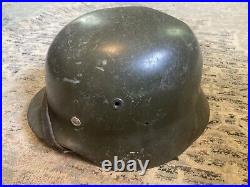 Original German Made M40 Stahlhelm Helmet With Some Battlefield Wear And Damage