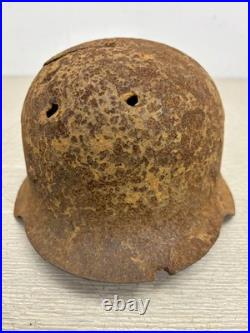 Original German WWII M42 Helmet with Bullet Hole Damage