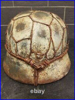 Replica WW2 German M40 helmet size 66 combat worn with wire reproduction. Made o