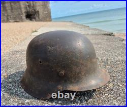 WW2 German Army Helmet M42 in very good condition, paint, pins, Normandy found WW2 German Army Helmet M42 in very good condition, paint, pins, Normandy found