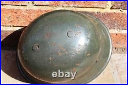 WW2 German M34 Helmet used like a combat helmet, good condition