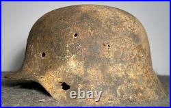 WW2 German M35 Helmet. Size 64. Battle-Damaged Relic. Found in Estonia WW2 German M35 Helmet. Size 64. Battle-Damaged Relic. Found in Estonia