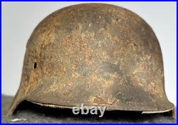 WW2 German M35 Helmet. Size 64. Battle-Damaged Relic. Found in Estonia WW2 German M35 Helmet. Size 64. Battle-Damaged Relic. Found in Estonia