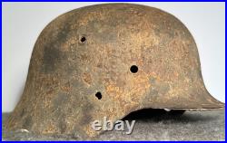 WW2 German M35 Helmet. Size 64. Battle-Damaged Relic. Found in Estonia WW2 German M35 Helmet. Size 64. Battle-Damaged Relic. Found in Estonia