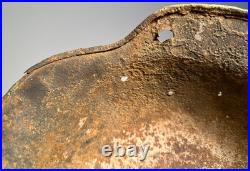 WW2 German M35 Helmet. Size 64. Battle-Damaged Relic. Found in Estonia WW2 German M35 Helmet. Size 64. Battle-Damaged Relic. Found in Estonia
