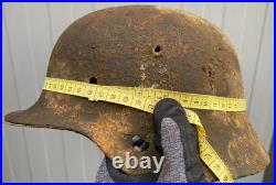 WW2 German M35 Helmet. Size 64. Battle-Damaged Relic. Found in Estonia WW2 German M35 Helmet. Size 64. Battle-Damaged Relic. Found in Estonia
