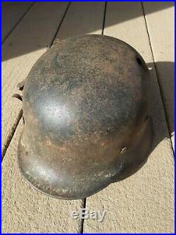 WW2 German M40 Combat Helmet with liner & strap, battle-damaged