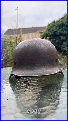 WW2 German Wehrmacht M40 combat helmet. Original and complete, as found