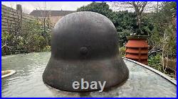 WW2 German Wehrmacht M40 combat helmet. Original and complete, as found