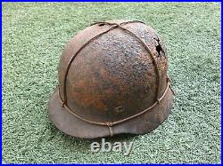 WW2 German combat helmet M40 with an original metal camouflage mesh. Size 65