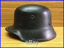 WW2 German volcano fiber parade helmet complete with liner and chin strap. M34