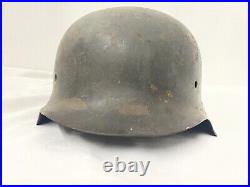WW2 Original German Army M-42 Battle Damaged Field Pickup Helmet. Large Size 68