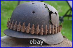 WW2 WWII Original German Helmet M35 (battle demages)from the battlefield. Kurland