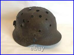 WW2 original German helmet M 40 with a lot of combat damage. Unique lot