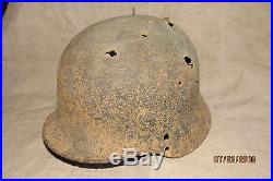 WWII German Battlefield Relic Helmet. Battle damaged
