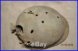 WWII German Battlefield Relic Helmet. Battle damaged