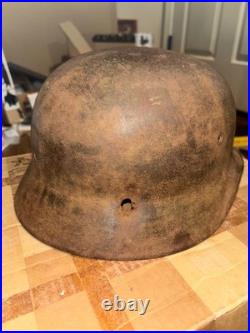 WWII German foot soldier helmet bullet shrapnel hole WWII WW2 world war