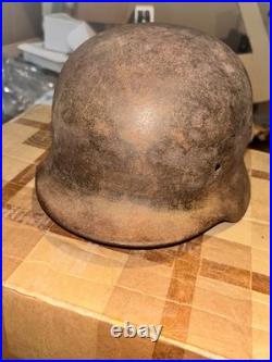 WWII German foot soldier helmet bullet shrapnel hole WWII WW2 world war