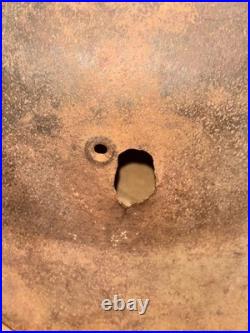 WWII German foot soldier helmet bullet shrapnel hole WWII WW2 world war
