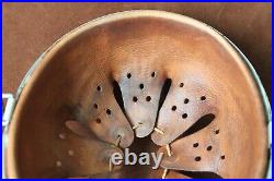 WWII German helmet liner + chin strap + rivets