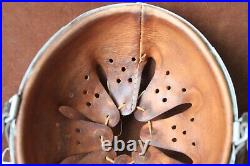 WWII German helmet liner + chin strap + rivets