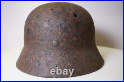 WWII WW2 German soldier M35 Helmet with battle damaged from Kurland #152 WWII WW2 German soldier M35 Helmet with battle damaged from Kurland #152