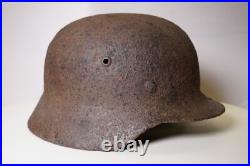 WWII WW2 German soldier M35 Helmet with battle damaged from Kurland #152 WWII WW2 German soldier M35 Helmet with battle damaged from Kurland #152