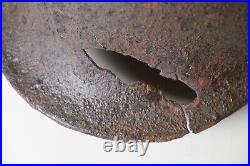 WWII WW2 German soldier M35 Helmet with battle damaged from Kurland #152 WWII WW2 German soldier M35 Helmet with battle damaged from Kurland #152
