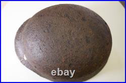 WWII WW2 German soldier M35 Helmet with battle damaged from Kurland #152 WWII WW2 German soldier M35 Helmet with battle damaged from Kurland #152