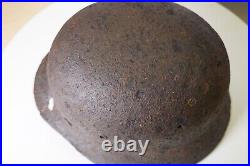 WWII WW2 German soldier M35 Helmet with battle damaged from Kurland #152 WWII WW2 German soldier M35 Helmet with battle damaged from Kurland #152