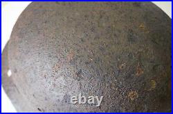 WWII WW2 German soldier M35 Helmet with battle damaged from Kurland #152 WWII WW2 German soldier M35 Helmet with battle damaged from Kurland #152