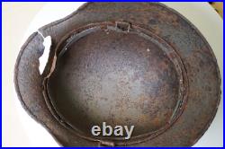 WWII WW2 German soldier M35 Helmet with battle damaged from Kurland #152 WWII WW2 German soldier M35 Helmet with battle damaged from Kurland #152