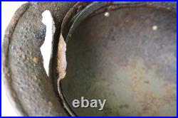 WWII WW2 German soldier M35 Helmet with battle damaged from Kurland #152 WWII WW2 German soldier M35 Helmet with battle damaged from Kurland #152