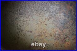 WWII WW2 German soldier M35 Helmet with battle damaged from Kurland #152 WWII WW2 German soldier M35 Helmet with battle damaged from Kurland #152