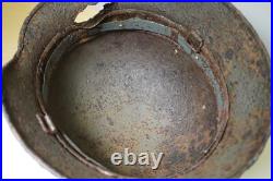 WWII WW2 German soldier M35 Helmet with battle damaged from Kurland #152 WWII WW2 German soldier M35 Helmet with battle damaged from Kurland #152