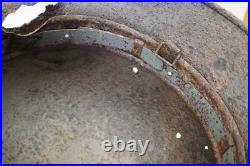 WWII WW2 German soldier M35 Helmet with battle damaged from Kurland #152 WWII WW2 German soldier M35 Helmet with battle damaged from Kurland #152