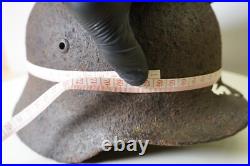WWII WW2 German soldier M35 Helmet with battle damaged from Kurland #152 WWII WW2 German soldier M35 Helmet with battle damaged from Kurland #152